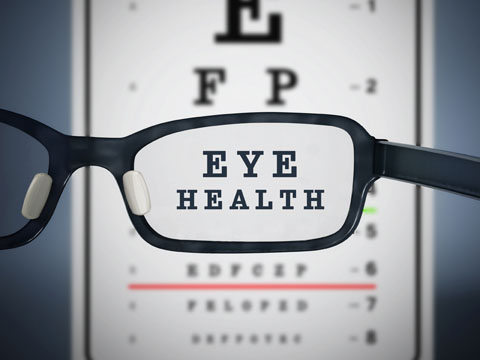 Eye exam chart with glasses in front